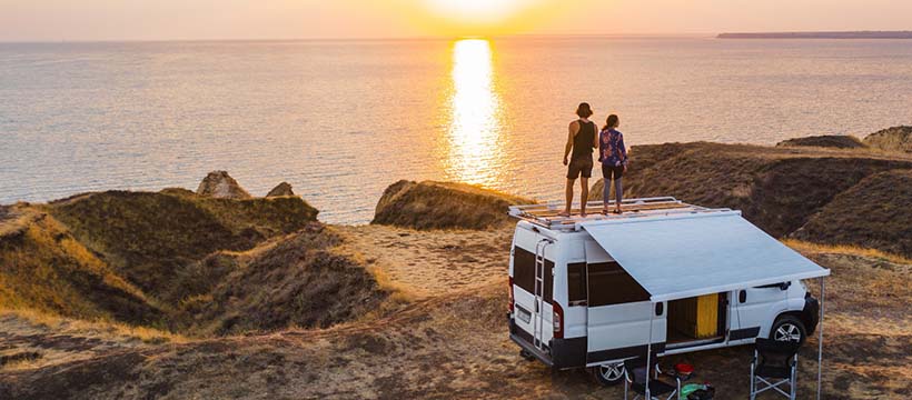 RV on beach during a sunset